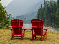 focused_176555046-stock-photo-two-wooden-red-chairs-shore.jpg