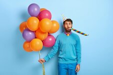 guy-with-birthday-hat-and-balloons-posing-in-blue-sweater_273609-31958.jpg