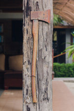 the-old-iron-ax-is-attached-to-the-wooden-house-pole_34159-523.jpg