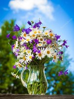 depositphotos_95266748-stock-photo-summer-bouquet-of-daisies-and.jpg
