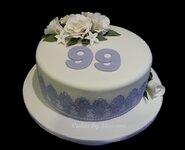 900_XkipCqTZiU-birthday-cake-featuring-cake-lace-and-gumpaste-flowers.jpg